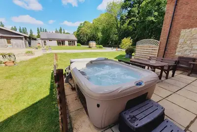Image de Jasmine Cottage avec bain à remous privé, pour 7 personnes