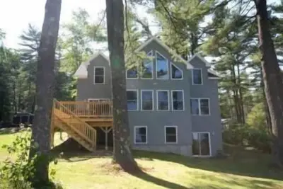 Image de Maison du lac Sebago avec plage de sable