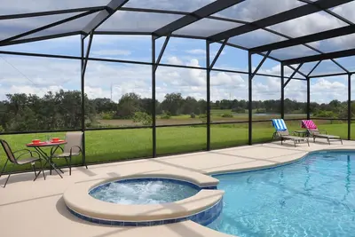 Image de Nouveau 5 chambres à thème, 4 salles de bain piscine maison sur un seul niveau. 20 minutes à Disney