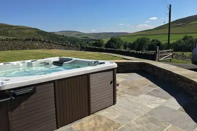 Image de conversion de grange joliment meublé près de Galashiels avec bain à remous