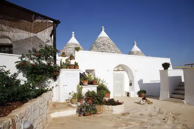 Image de Trullo + Lamia, à 10 minutes de la mer, des vues panoramiques et bain à remous