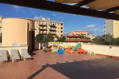 Image de Appartement dans villa à 2 minutes de la mer (wi fi gratuit, solarium, jeux)