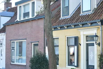 Image de Maison de vacances spacieuse avec jardin - au centre du village - à distance de marche de Veerse Meer