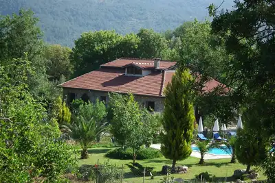 Image de Villa Eden est des vacances historiques avec piscine privée et jardin à Kayaköy