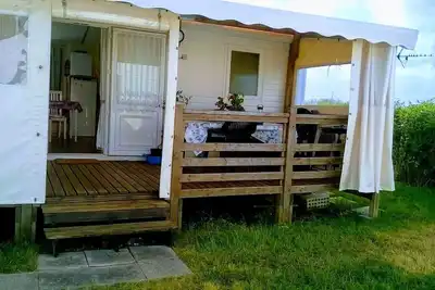 Image de Mobil home tout confort sur jardinet privé 140m2 (camping très calme)