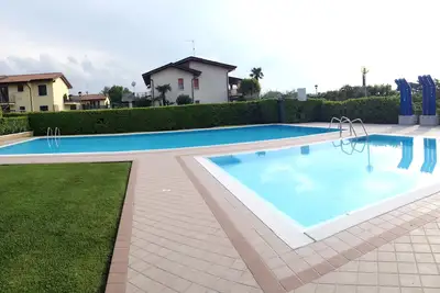 Image de Charmant appartement, n. 2 piscines, parking, 1 200m de Lazise/lac de Garde