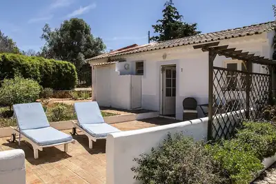 Image de Chambre Double avec Terrasse Solaire et Piscine Commune