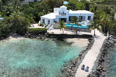 Image de Une Route De La Plage; 5 chambres, 5 1/2 salles de bain Oasis St Thomas Vi en bord de mer