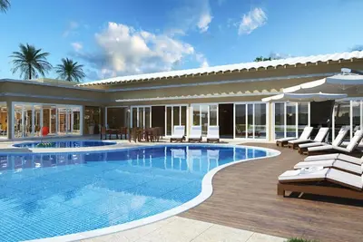 Image de Copropriété de haut standing avec structure de villégiature, piscine chauffée, salle de gym