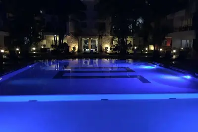 Image de Incroyable Condo, à quelques pas de la plage et de la célèbre 5ème avenue! Rabais d'été!