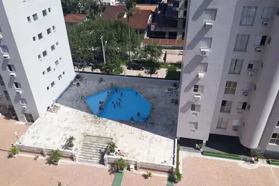Image de Bel appartement à Enseada Guarujá. Copropriété, zone de loisirs, proche de la plage