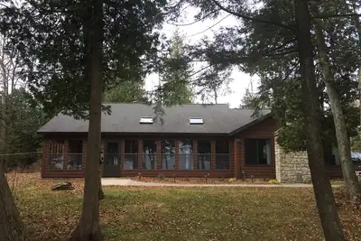 Image de Grands levers de soleil, 200 pieds du lac Michigan Shorefront, 1. 5 acres, 2 chambres, 1 salle de bain