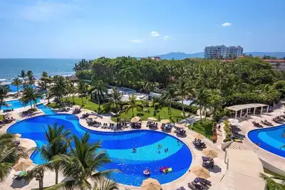 Image de À couper le souffle Villa Magna Beachfront Condo, 3 chambres pour 6 personnes