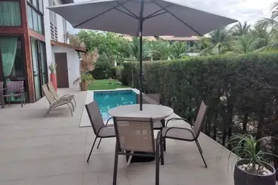Image de Beach House avec piscine située dans le meilleur condo de plage à Muro Alto