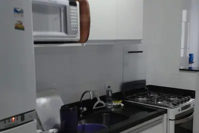 Image de Apt Season High Standard Praia Grande Ubatuba, près du belvédère des Toninhas