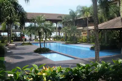 Image de Appartement en copropriété de style polynésien face à la mer - 1 suite