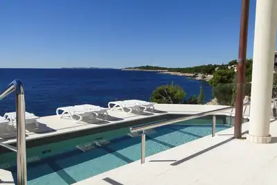 Image de Appartement de vacances en bord de mer avec piscine commune