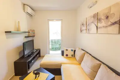 Image de Appartement face à la plage avec balcon et vue sur le jardin