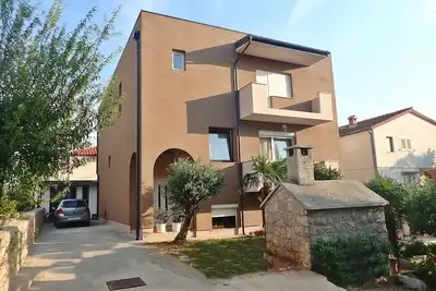 Image de Appartement près de la plage avec wifi gratuit et climatisation