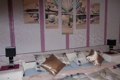 Image de Vacances en mer du Nord dans un grand confort appartement balcon chaise de plage jardin barbecue