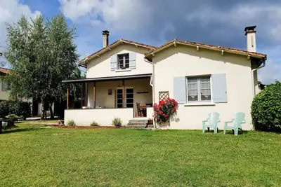 Image de La Veranda - Une belle propriété de 3 chambres avec jardin privé.