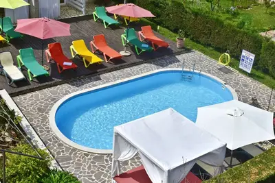 Image de Apartamento Nika1 à Umag, piscine, jacuzzi, WiFi, climatisé, proche de la mer