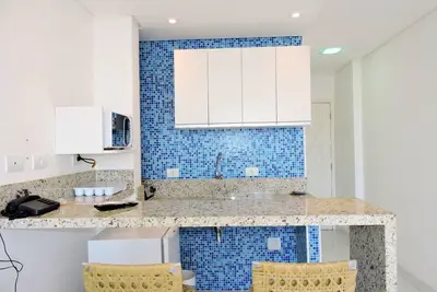 Image de Kitnet avec air conditionné à Guaruja