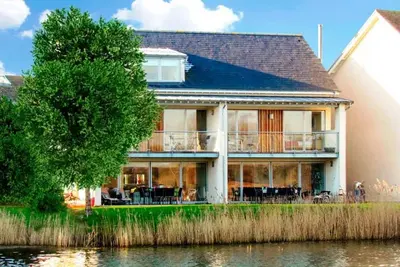 Image de Maison de vacances Lower Mill avec plage / lac à proximité, balcon / terrasse et golf