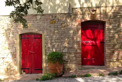 Image de Agriturismo Le Capanne: ferme biologique nichée dans les collines toscanes. Amelia
