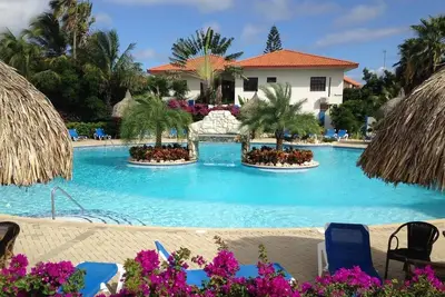 Image de Apartment BonBininaCuracao Grande piscine dans un complexe tropical gardé