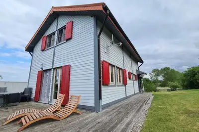 Image de H12 Holz-Ferienhaus Haffblick Russow près de Ostseebad Rerik - Cottage en bois de 4 pièces avec cheminée (100 m²;