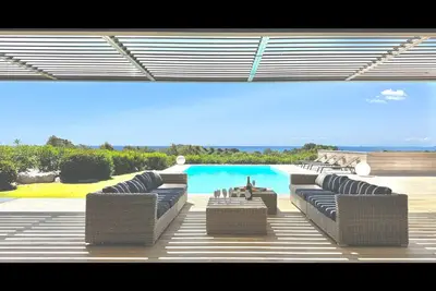 Image de Longahouses : Piscine chauffée, Vue panoramique mer et Sardaigne