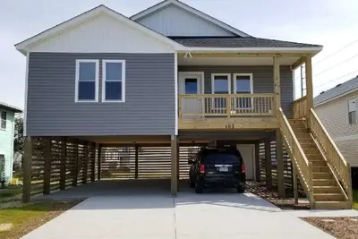 Image de Maison neuve. Marcher à la plage!