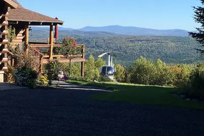 Image de Belle maison en bois rond avec vue sur la montagne et le lac et bain à remous-8 personnes
