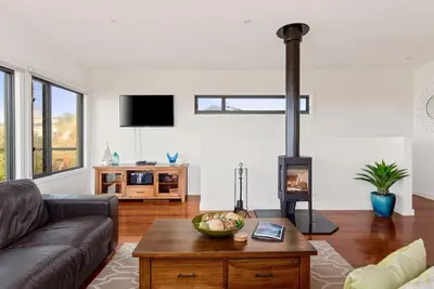 Image de Retraite de luxe à Pristine Surf Beach - avec foyer au bois