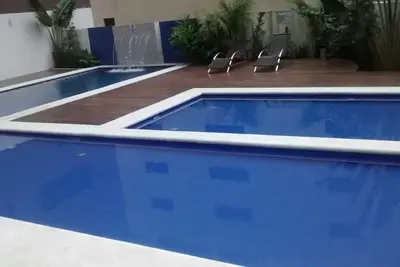 Image de Appartement de deux chambres avec piscine.