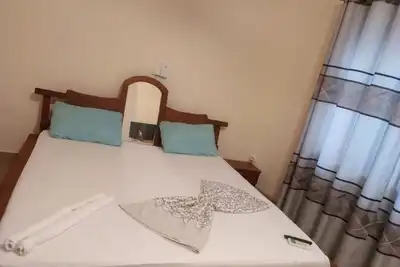 Image de 100 m from the beach and the airport- 2 bedroom and 1 living room