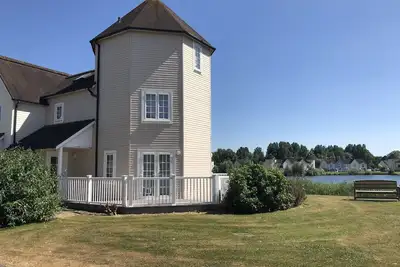 Image de Superbe Lodge de style Nouvelle-Angleterre au bord du lac