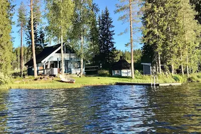 Image de Kömmäkköniemi – Your Spacious Log Cottage in Central Finland with Hot Tub