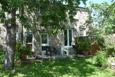 Image de Converti Coach House Dans privée Localisation