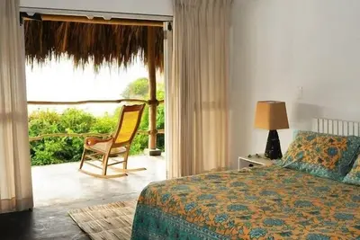 Image de Hermosa Cabaa Entre El Ro Y El Mar