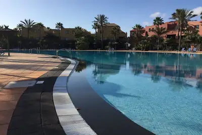 Appartement dans un beau complexe avec grande piscine et terrasse privée
