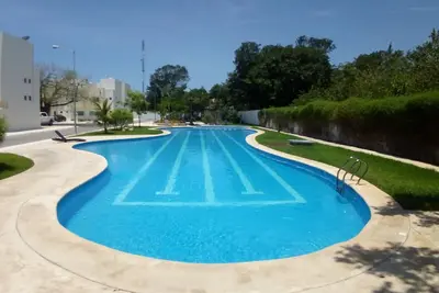 Image de Maison dans condo près de la plage, le 5ème. Av et Xcaret. Piscine, Wi Fi, Netflix,