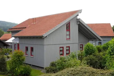 Image de Ferienholzhausatmosphäre, cuisine, 4 personnes, internet et piscine d'aventure