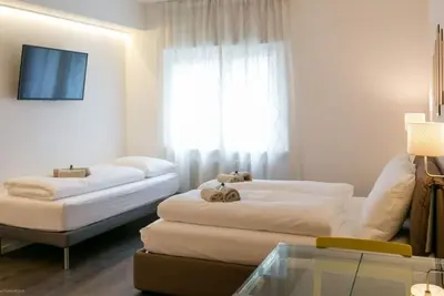 Image de Bel appartement design dans la vieille ville directement sur la Piazza Erbe