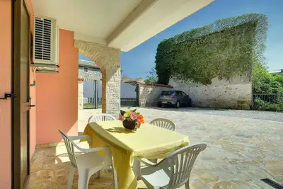 Image de Appartement de vacances avec terrasse privée et jardin à usage commun