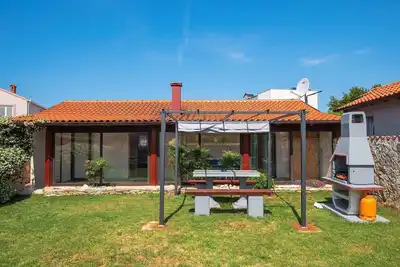 Image de Maison de vacances avec jardin et air conditionné