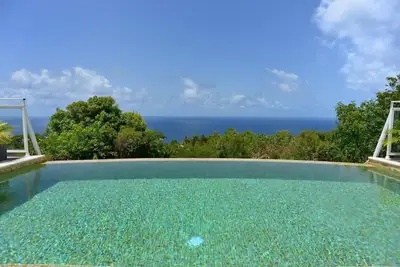 Image de Vue imprenable sur l'océan, Piscine chauff��e, Cuisine moderne, Home Cinema, Wifi