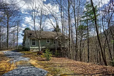 Image de Cabine avec vue, bain à remous, foyer.