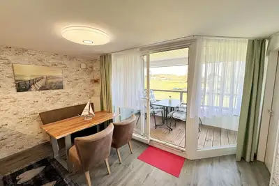 Image de Appartement 06a avec balcon et Boddenblick - Haus Inselperle surplombant la baie